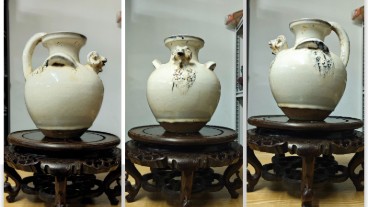 白釉双系兽头壶